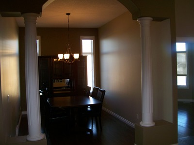 Painted interior, with a table and two windows