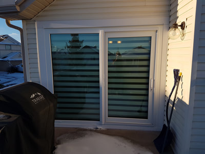 Exterior view of a sliding door closed in the winter time